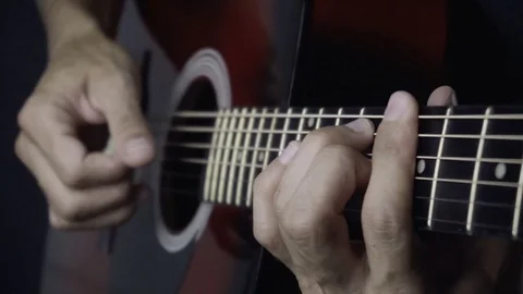 Man playing guitar on black background. Six strings. Playing with fingers Video stock 79037375