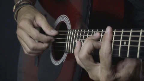 Man playing guitar on black background. Six strings. Playing with fingers Video stock 79037599