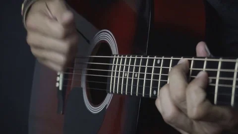 Man playing guitar on black background. Six strings. Playing with fingers Video stock 79038042