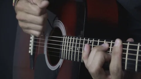 Man playing guitar on black background. Six strings. Playing with fingers Video stock 79038213