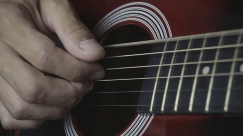 Man playing guitar on black background. Six strings. Playing with fingers Video stock 79040593