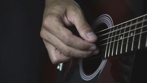 Man playing guitar on black background. Six strings. Playing with fingers Video stock 79042118