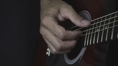 Man playing guitar on black background. Six strings. Playing with fingers Video stock 79042370