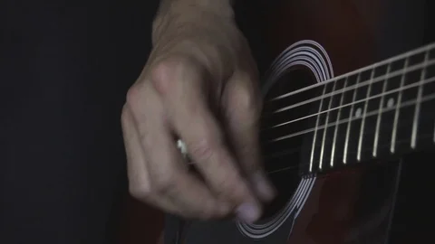 Man playing guitar on black background. Six strings. Playing with fingers Video stock 79043287