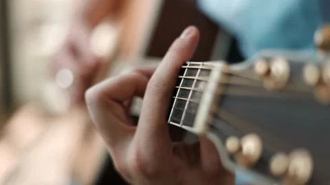 Man Playing Guitar Close- Man playing guitar chords Stock Footage 202279426