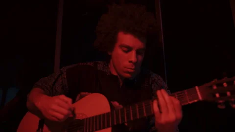 Man Playing a Guitar in the Dark Stock Footage 258347732