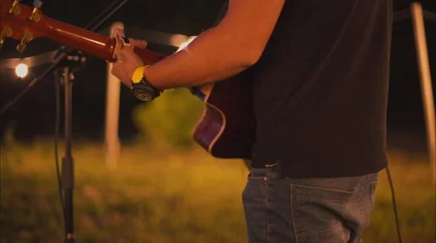 Man is playing guitar in the evening Stock Footage 53920305