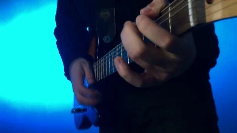 Man playing with guitar Stock Footage 70642168