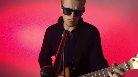 Man playing with guitar Stock Footage 70642304