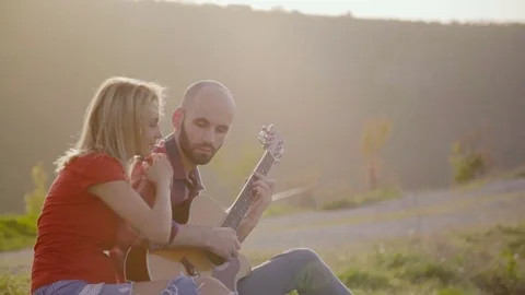 Man playing guitar Stock Footage 75257854