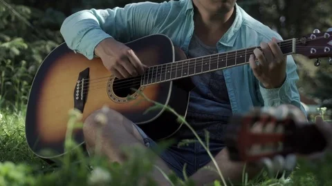 Man playing the guitar Stock Footage 79856358
