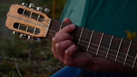 Man playing on guitar Stock Footage 82214311