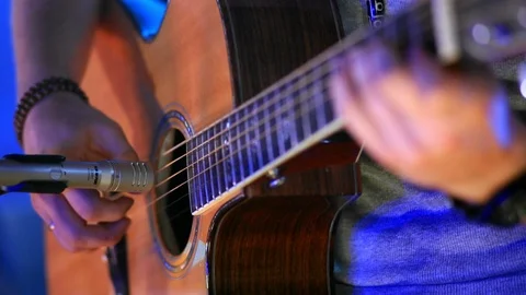 Man playing the guitar, hand close-up Stock Footage 99578149