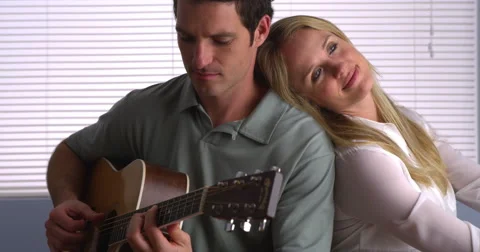 Man playing guitar for his girlfriend Video stock 44482113