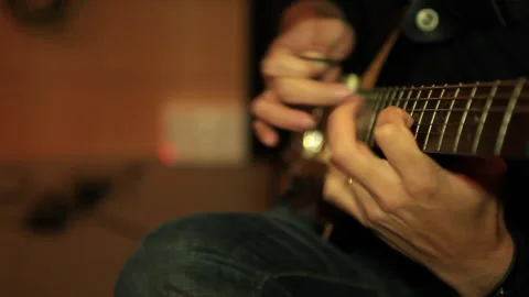 Man playing guitar inside building 스톡 동영상 293007469