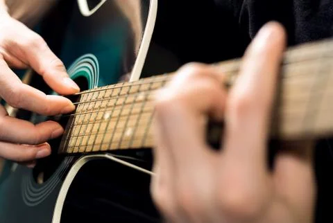 Man playing on the guitar Stock Photos