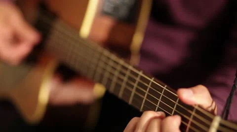 Man Playing Guitar (Rack focus) Stock Footage 44733661