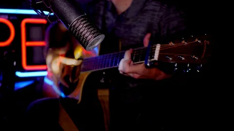 Man playing guitar in recording studio Stock Footage 105531811