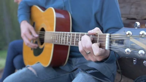 Man Playing a Guitar in Slow Motion Video stock 89140352