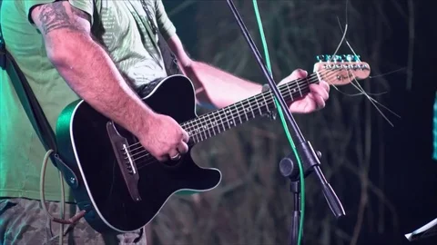 Man playing guitar solo 4k Stock Footage 69964211