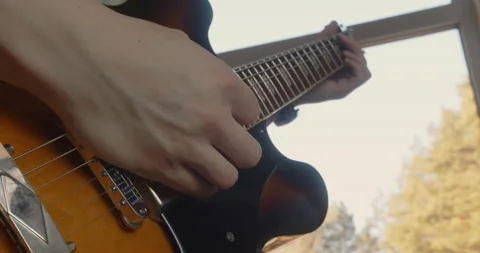 Man playing a guitar solo Stock Footage 170384969