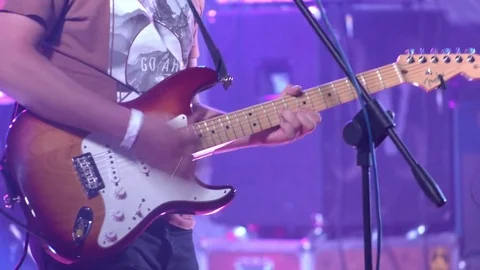 Man playing guitar solo on a stage 4k Stock Footage 69949181
