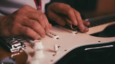 Man Playing Guitar in the Studio Stock Footage 49479731