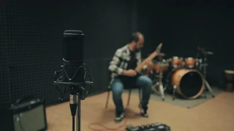Man playing guitar in studio. 動画素材 58482284