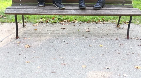 Man playing guitar while woman sitting next to him Stock Footage 59556825