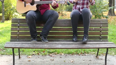 Man playing guitar while woman singing Stock Footage 59556831
