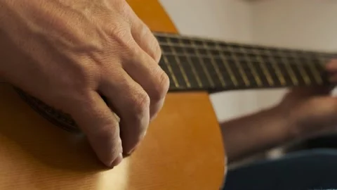 Man playing guitar.hand on the strings of a guitar. Stock Footage 167576498