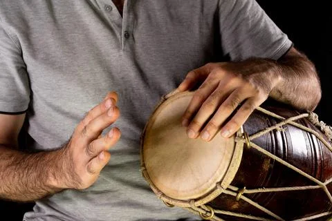 Man playing hand drum with his hands Stock Photos