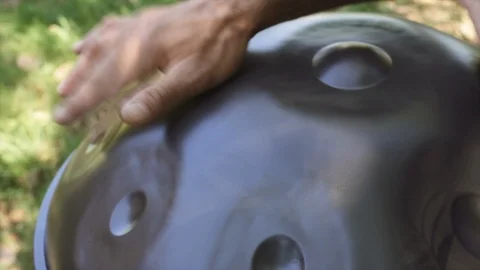 Man playing handpan Stock Footage 95775264