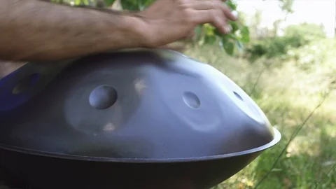 Man playing handpan Stock Footage 95775320