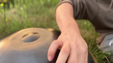 Man Playing Handpan in Nature Stock Footage 282345798