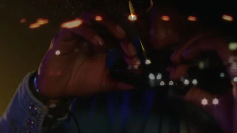 Man playing harmonica in music studio, showing animated bokeh lights and denim Vidéo 307800805