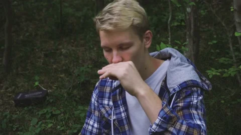 Man is playing on harmony Stock Footage 161638438