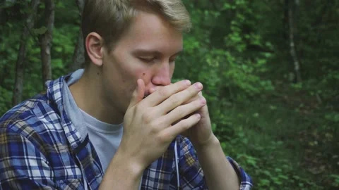 Man is playing on harmony Stock Footage 161638982