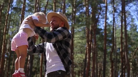 Man playing with his child while walking in the woods. Stock-Footage 149946527