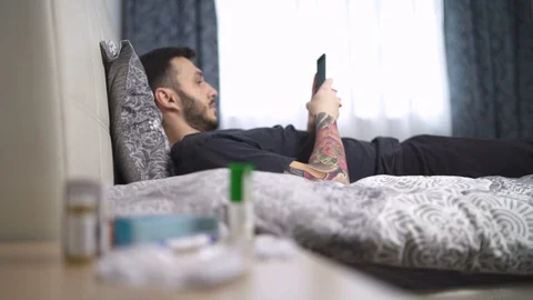 Man playing on his phone during quarantine. Stay home Stock Footage 129837285