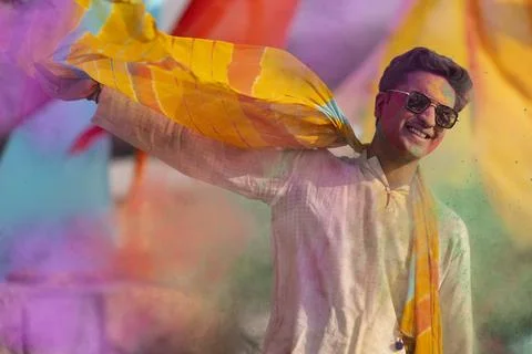 Man playing holi and dancing with gulal on his face Stock Photos
