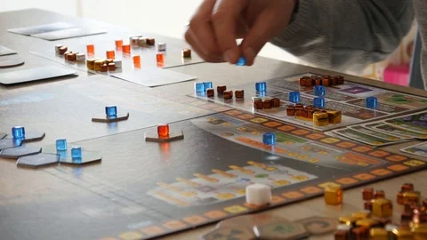 A Man playing at Home Table Board Game with Cards, go Chips and Dice Stock Footage 86211351