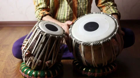 Man playing on Indian tabla drums on a wooden floor Stock Footage 58027828