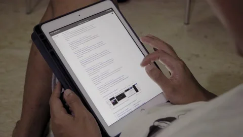 Man playing with ipad / tablet 스톡 동영상 133726194