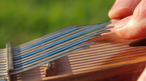 Man is playing the Kalimba Stock Footage 61207466