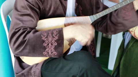 A man playing the Kazakhstan stringed instrument "Dombra" Stock-Footage 280360324