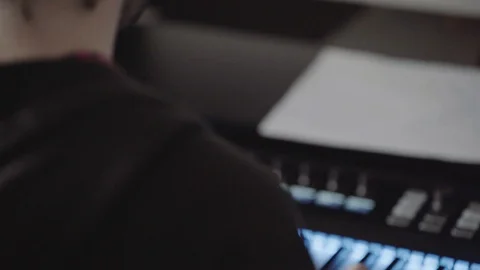 Man playing keyboard and recording music Stock Footage 88054009