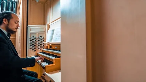 Man Playing On The Keyboard Of An Organ Video stock 73673135