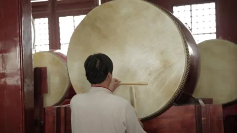 Man Playing Large Drum Inside Drum and Bell Tower in Beijing China Stock Footage 341712147