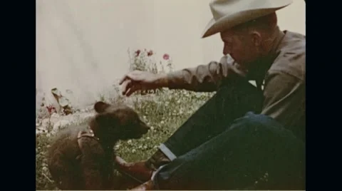 Man Playing with little Smokey Stock Footage